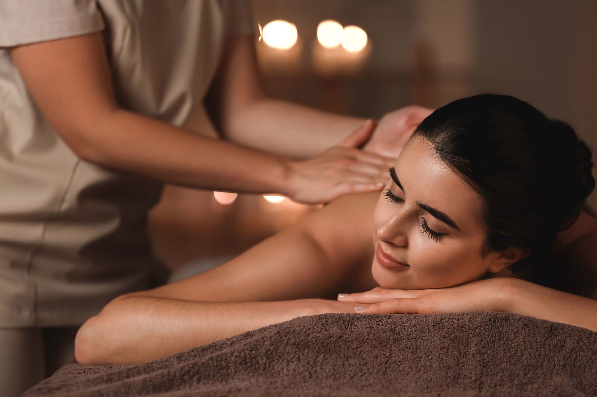 Woman relaxing during a back massage